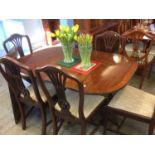 A mahogany dining table and six chairs