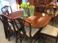 A mahogany dining table and six chairs