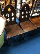 A pair of 'Gothic' hall chairs