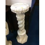 An alabaster pedestal