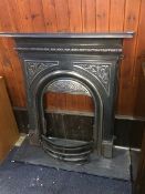 A Victorian style cast iron fire surround