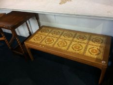 An oak barley twist table and a teak tiled coffee table