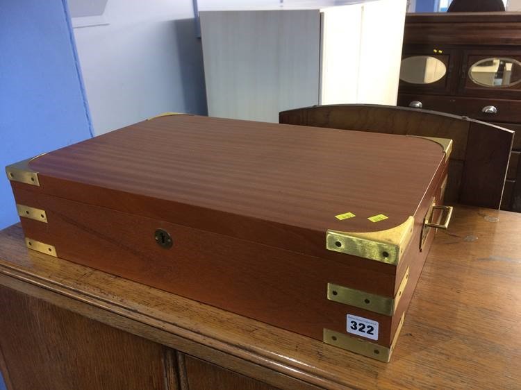 A brass capped teak box