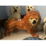 A pair of Staffordshire Spaniels and a Victorian standing Lion