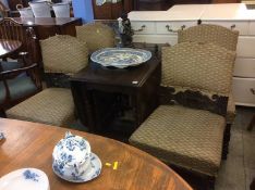 An oak table and four chairs