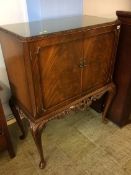 A mahogany cabinet on cabriole legs