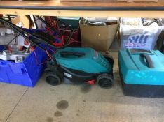 Assorted tools and a Bosch lawnmower