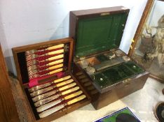 A 19th Century rosewood vanity case and a canteen of fish knives and forks