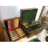 A 19th Century rosewood vanity case and a canteen of fish knives and forks