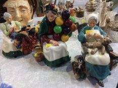 Three Royal Doulton figures; 'Nanny', 'The Old Balloon Seller' and 'The Wardrobe Mistress' (3)