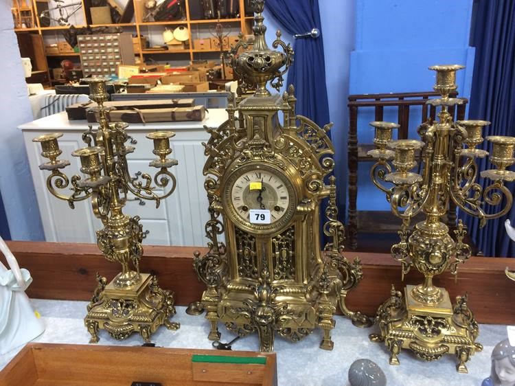 A modern ornate gilt metal clock garniture