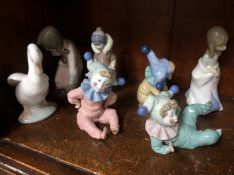 Four Nao and three Lladro figures