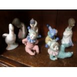 Four Nao and three Lladro figures