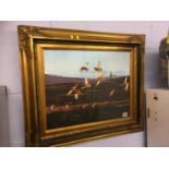 A gilt framed print