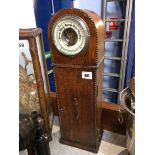 An oak cased barometer