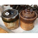 A Doulton stoneware jar and cover and a Doulton Lambeth stoneware biscuit barrel with silver mounts