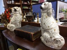 A tall pair of Victorian Staffordshire Spaniels and a leather bound bible