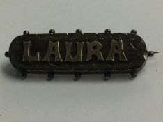 A silver brooch 'Laura'