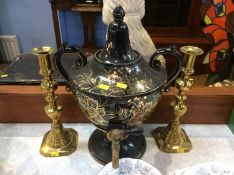 A Victorian urn and a pair of brass candlesticks