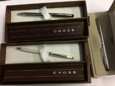 Three boxed Cross pens