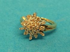 A diamond cluster ring, size K, stamped 9k, 2.8gram