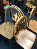 A set of four Ercol hooped back chairs