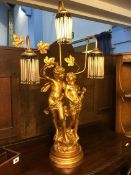 A cherub three branch table lamp