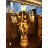 A cherub three branch table lamp