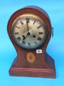 An Edwardian mahogany balloon clock, with silvered dial and 8 day movement, 43cm height