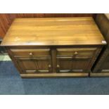 An Ercol two drawer dresser base, 98cm wide