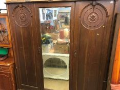 An oak triple door wardrobe, 182cm wide x 200cm high