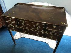 A Reprodux mahogany side table, with cutlery drawers and brushing slide, 96cm wide