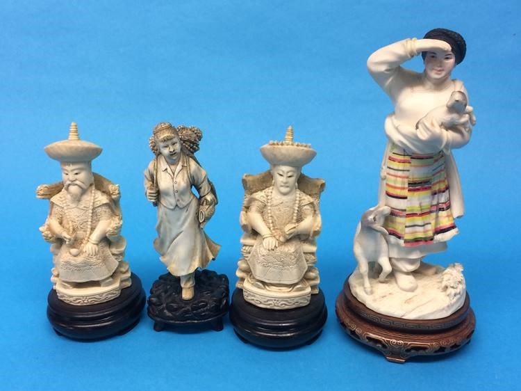 Four Oriental resin figures