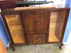 A walnut china cabinet