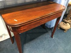 A 19th century mahogany fold over tea table, 91cm length