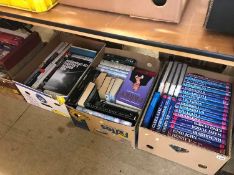 Four boxes of books and puzzles