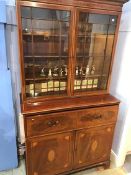 A 19th century mahogany secretaire bookcase with two glazed doors, below a fall front revealing a