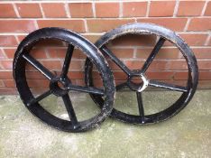 A pair of cast wheels