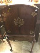 A walnut dome top cocktail cabinet, 68cm wide