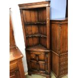 An oak Chapman 'Siesta' standing corner cabinet (possibly Titchmarsh and Goodwin)