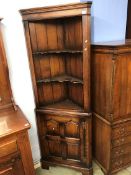 An oak Chapman 'Siesta' standing corner cabinet (possibly Titchmarsh and Goodwin)