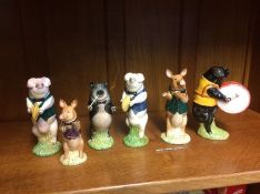 Thirteen boxed Beswick clown figures and six Beswick 'Pig Band' figures (boxed)