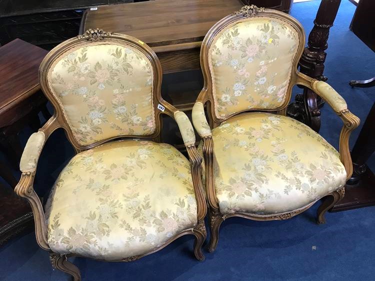 A pair of French open armchairs