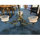 A brass hanging three branch ceiling light, with three etched glass shades