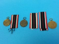 Three civilian War Merit medals