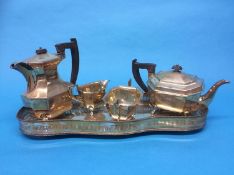 A silver four piece tea service, Viners, Sheffield, tea pot dated 1947, coffee, milk and sugar all