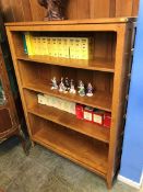 An oak 'Knightman' open bookcase with three fitted shelves, 107cm wide