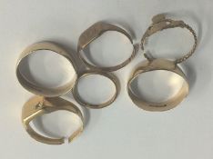 Five 9ct rings, 9.4 grams and one other with rubbed marks (total weight 18 grams)