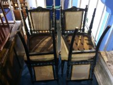 A set of four ebonised Edwardian chairs