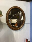 Pair of oval mirrors and a bedside table